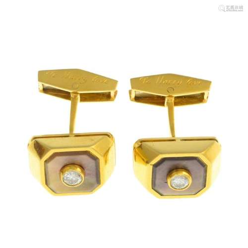 A pair of diamond and mother-of-pearl cufflinks. Each