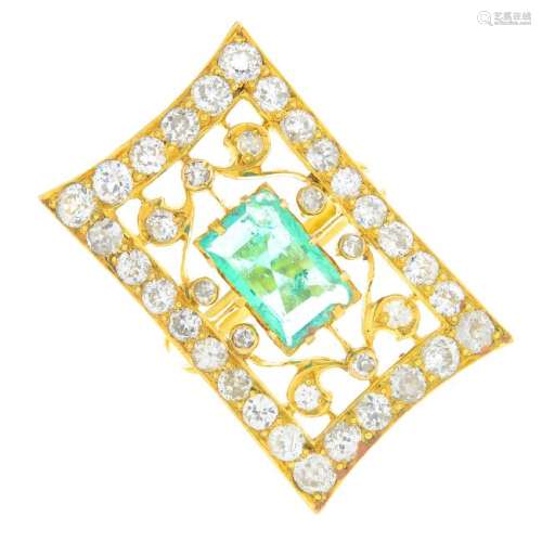 An emerald and diamond dress ring. Of openwork design,