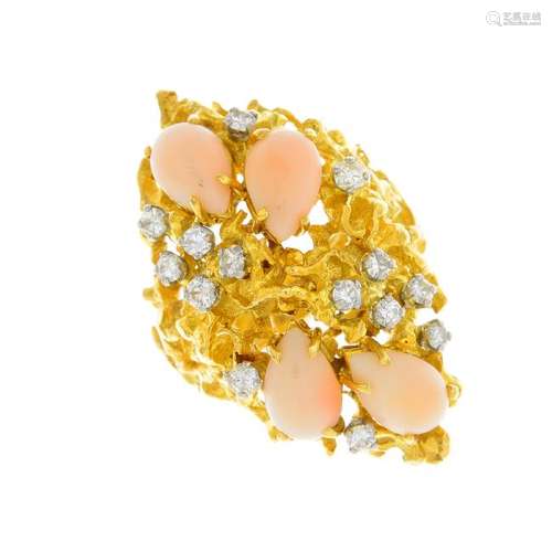 A 1970s coral and diamond ring. Of openwork design,