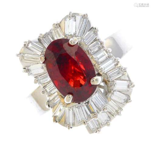 A spinel and diamond cluster ring. The oval-shape red