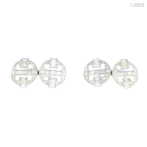 A pair of diamond cufflinks. Each of openwork design,