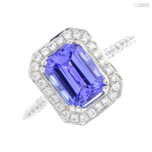 An 18ct gold tanzanite and diamond cluster ring. The