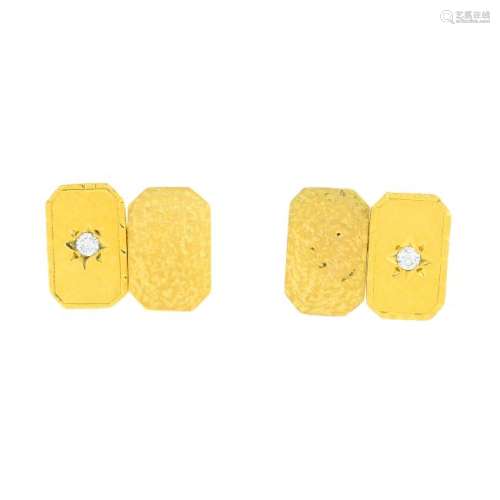 A pair of 18ct gold diamond cufflinks. Each designed as