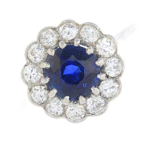 A Sri Lankan sapphire and diamond cluster ring. The