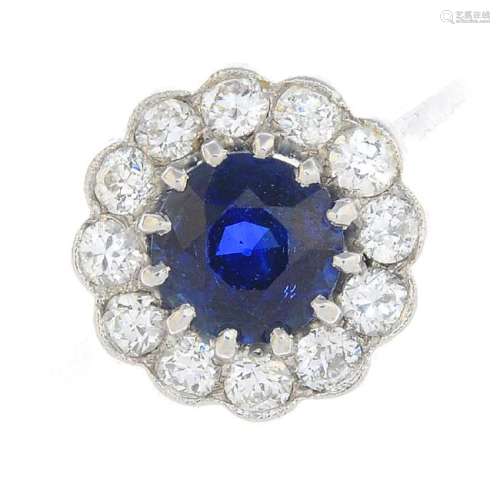 A Sri Lankan sapphire and diamond cluster ring. The
