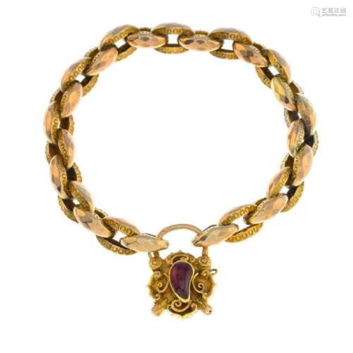 A late Victorian gold garnet bracelet. Designed as a