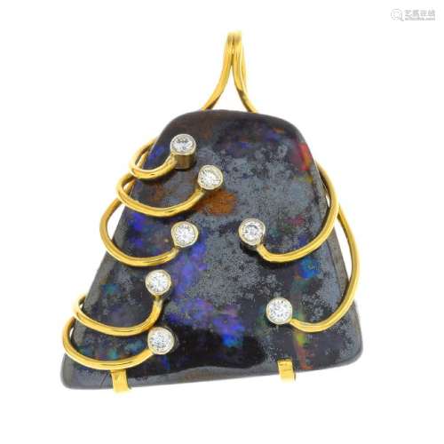 A boulder opal and diamond pendant. The free form