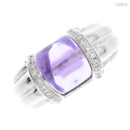 An 18ct gold amethyst and diamond ring. The curved