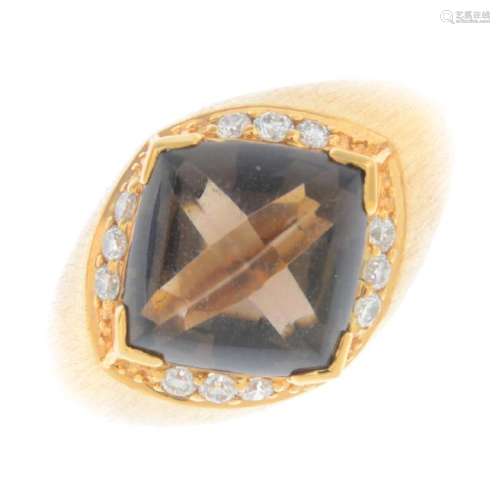 An 18ct gold smoky quartz and diamond ring. The
