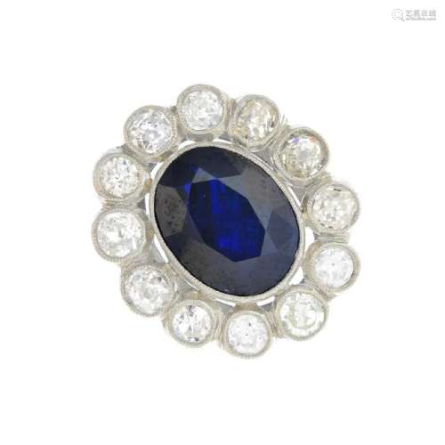 A platinum sapphire and diamond cluster ring. The