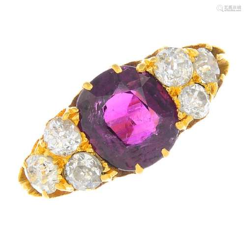 A ruby and diamond ring. The oval-shape shape ruby,