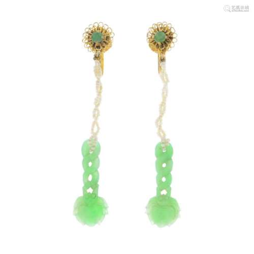 A pair of jade and seed pearl earrings. Each designed