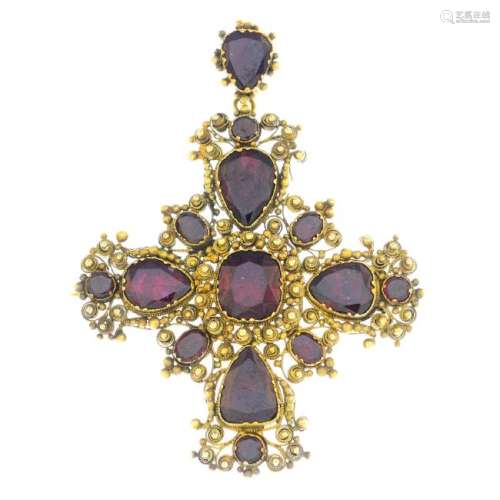 A mid Victorian gold garnet cross pendant. Designed as