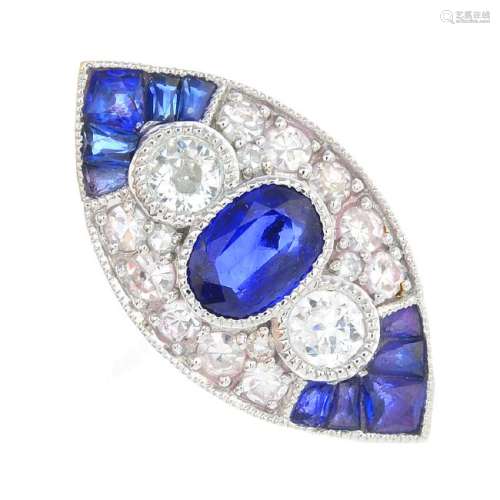 A sapphire and diamond dress ring. Of marquise-shape