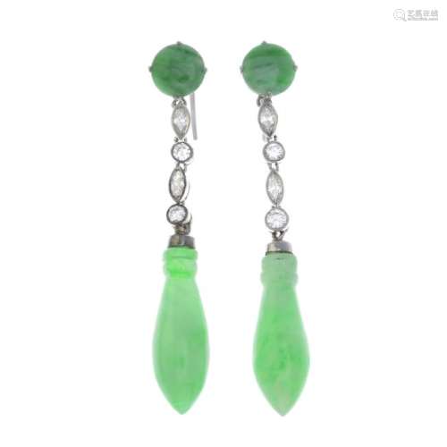 A pair of diamond and jade earrings. Each designed as