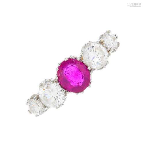 A glass-filled ruby and diamond five-stone ring. The