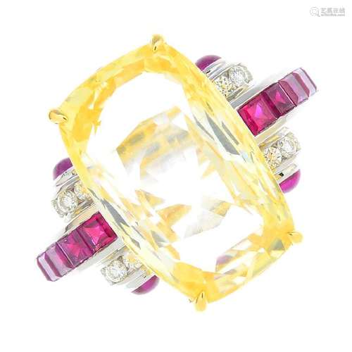 A sapphire and gem-set ring. The cushion-shape yellow