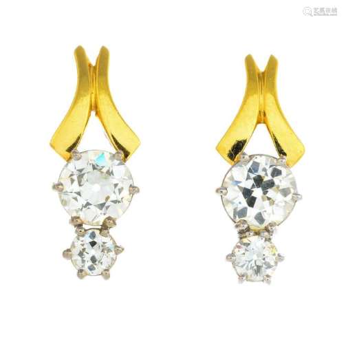 A pair of 18ct gold diamond earrings. Each designed as