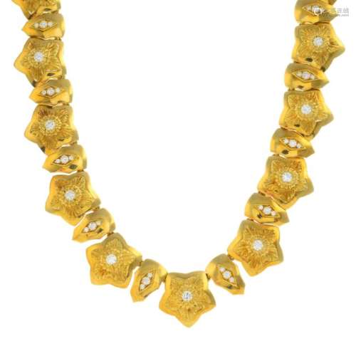 An 18ct gold diamond necklace. Designed as a series of