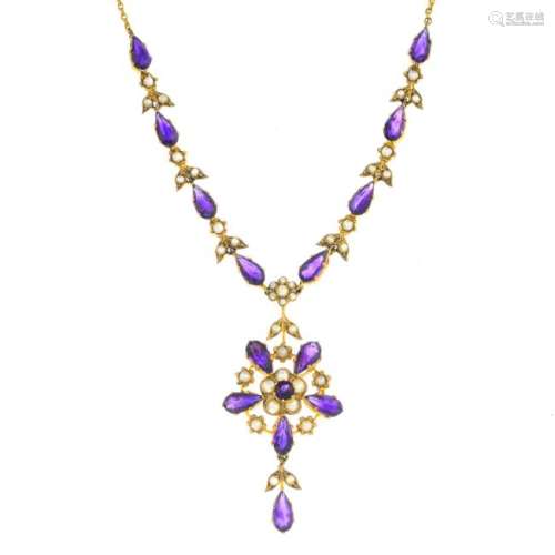 An Edwardian gold amethyst and split pearl necklace.