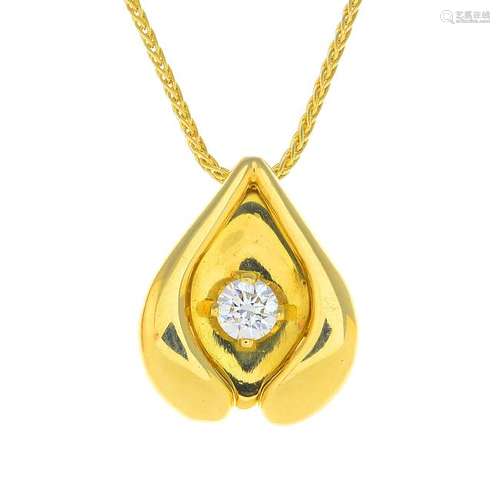 An 18ct gold diamond pendant. Designed as a grooved