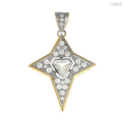 A diamond pendant. Designed as a stylised cross, the