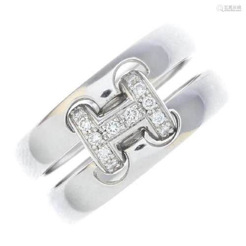 HERMES - a diamond 'H' ring. The brilliant-cut diamond