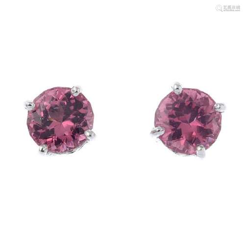 A pair of spinel stud earrings. Each designed as a