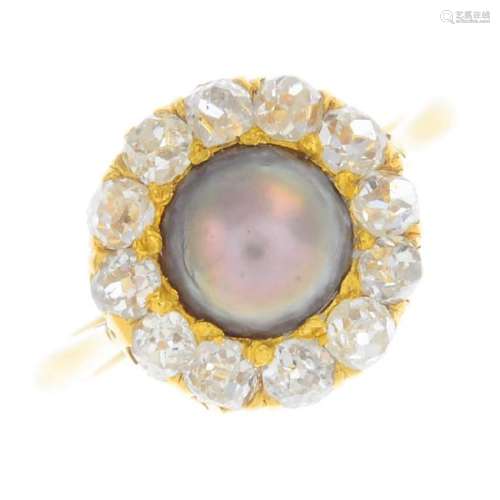 A cultured pearl and diamond cluster ring. The brown
