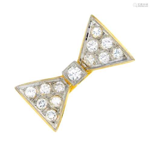 A diamond ring. Designed as a pave-set diamond bow,