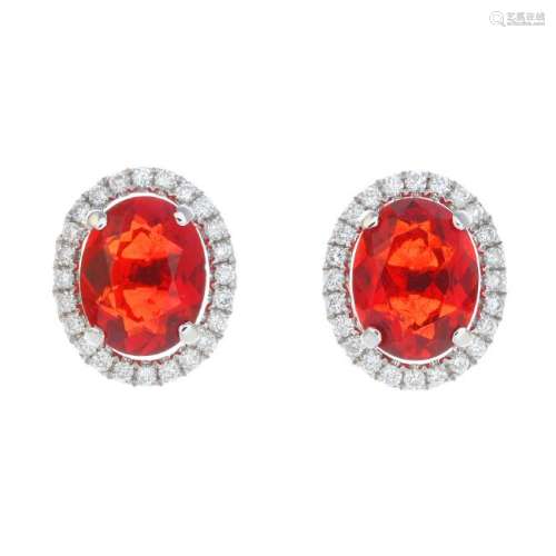 A pair of 18ct gold fire opal and diamond earrings.