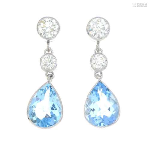 A pair of aquamarine and diamond drop earrings. Each