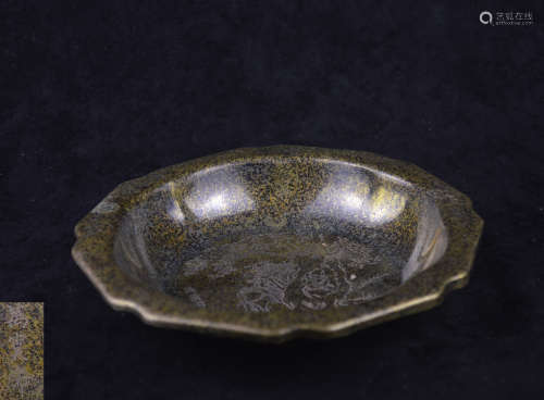 A BRONZE MOLDED PLATE