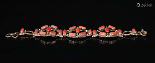 A SILVER CASTED CORAL DECORATED BRACELET