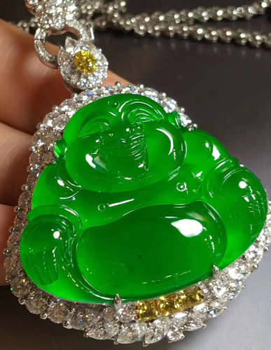 A LAUGHING BUDDHA SHAPED JADEITE PENDANT