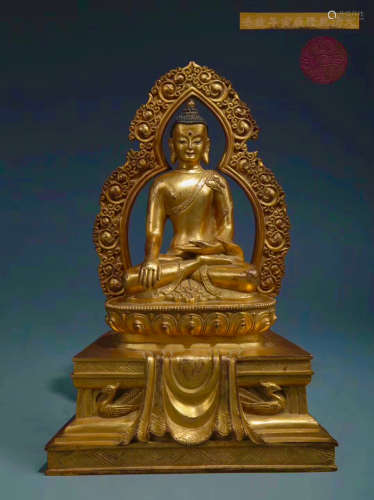 A GILT BRONZE MOLDED SAKYAMUNI BUDDHA STATUE