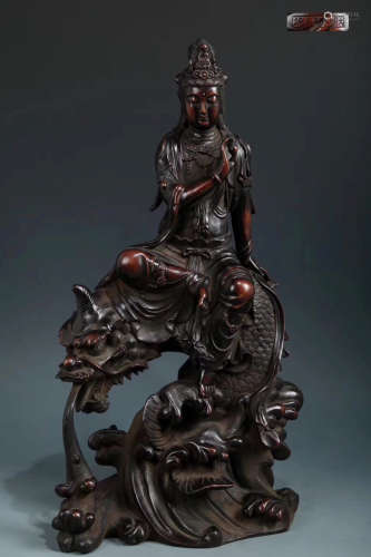 A BRONZE MOLDED GUANYIN DRAGON SHAPED STATUE