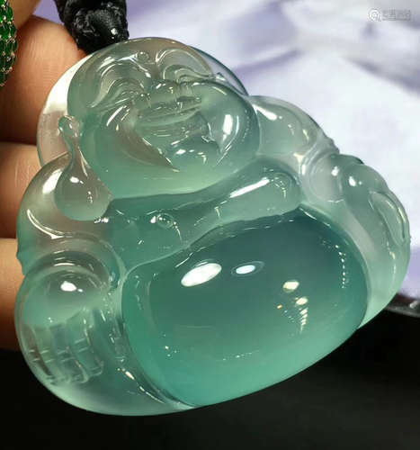 A LAUGHING BUDDHA SHAPED JADEITE PENDANT