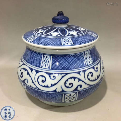 A BLUE AND WHITE COVER JAR