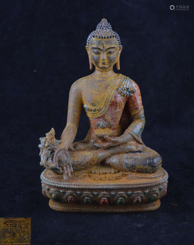 A BRONZE MOLDED COLOR BUDDHA STATUE