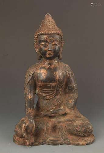 A CAST IRON AKSHOBHYA BUDDHA STATUE