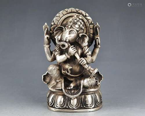 A SMALL AND FINELY CARVED TIBETAN BRONZE BUDDHA