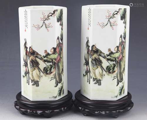 A PAIR OF STORY PAINTED PORCELAIN BRUSH POT