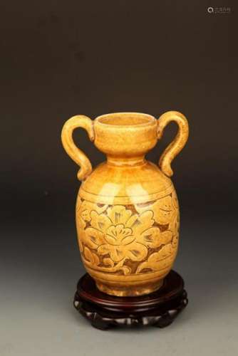 A YELLOW GLAZED FLOWER CARVING PORCELAIN BOTTLE