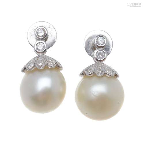 A pair of cultured pearl and diamond earrings