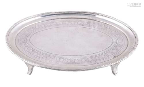 A George III silver oval tea pot stand by Charles Chesterman II