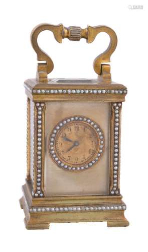A brass cased miniature carriage clock