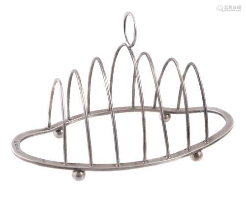 A silver navette shaped toastrack by J. A. Campbell