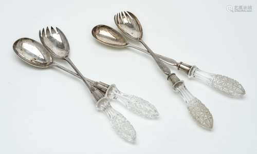 Two pairs of silver salad servers