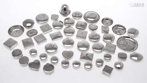 A collection of silver coloured small boxes